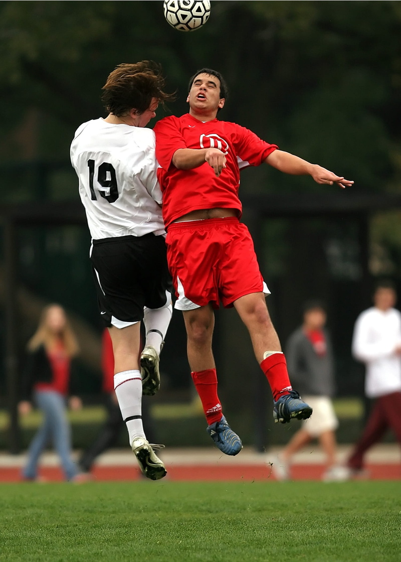 sport, red, sports uniform, competition, players, men, outdoors, team sport, running, soccer uniform, game, grass, soccer, childhood, effort, people, full length