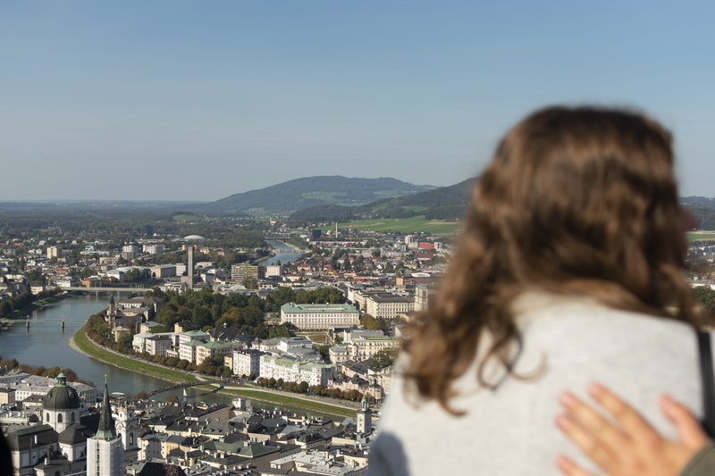 day, hairstyle, fortress hohensalzburg, river, looking at view, headshot, urban, nature, salzburg, people, one person, real people, long hair, women, buildings