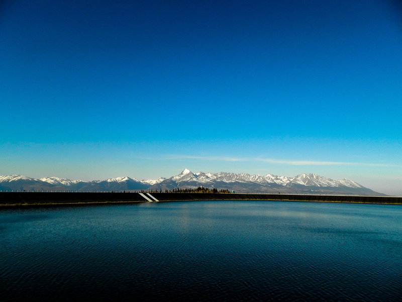 hybe was, mountains, swimming, snow, landscape, lake, tranquility, sport, lagoon, cold temperature, nature, mountain peak, waterfront, mountain, country
