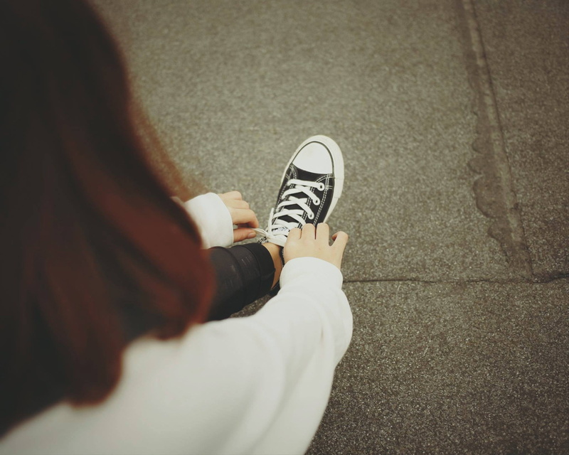 lifestyles, unrecognizable person, directly above, casual clothing, people, sneaker, human leg, tie, leisure activity, footpath, jeans, human foot, standing
