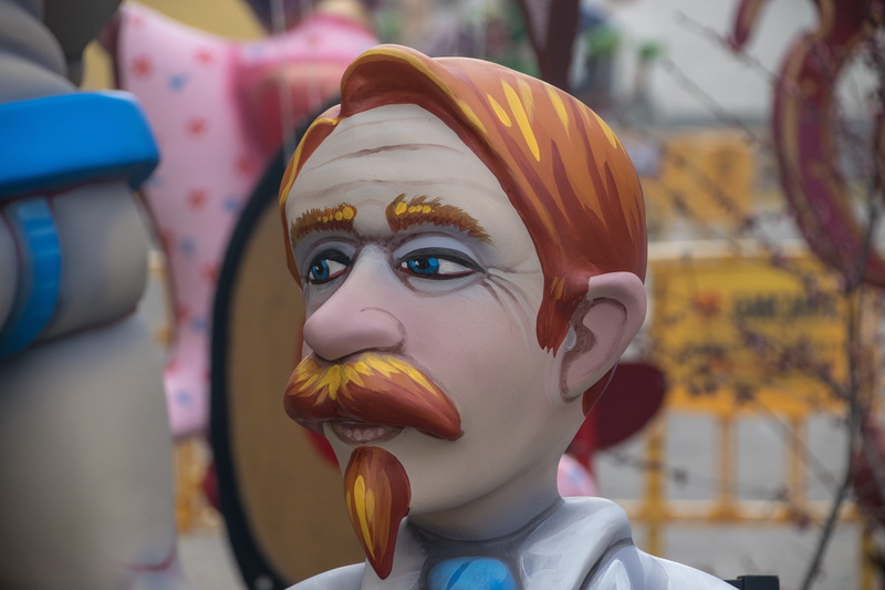 multi colored, focus on foreground, human representation, sculpture, outdoors, childhood, close-up, art and craft, ninot, 5K, headshot, people, amusement park