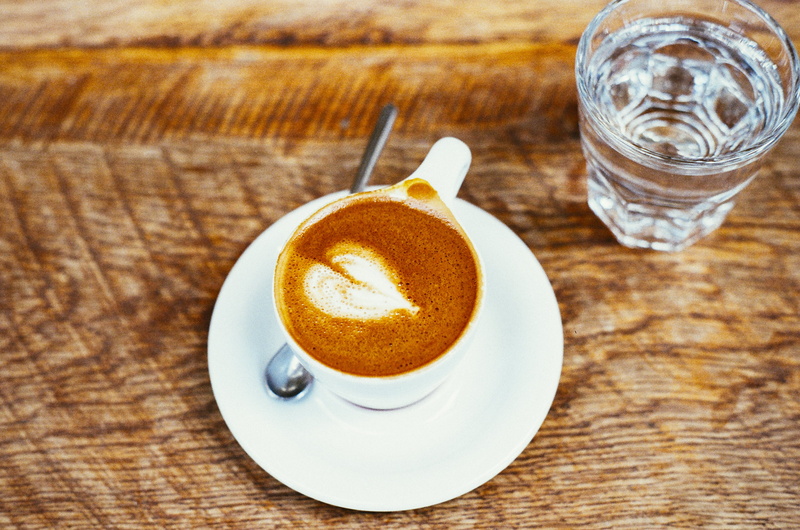glass, frothy drink, food and drink, mocha, cafe, high angle view, wood - material, beverage, no people, drinking glass, refreshment, white, drink, still life