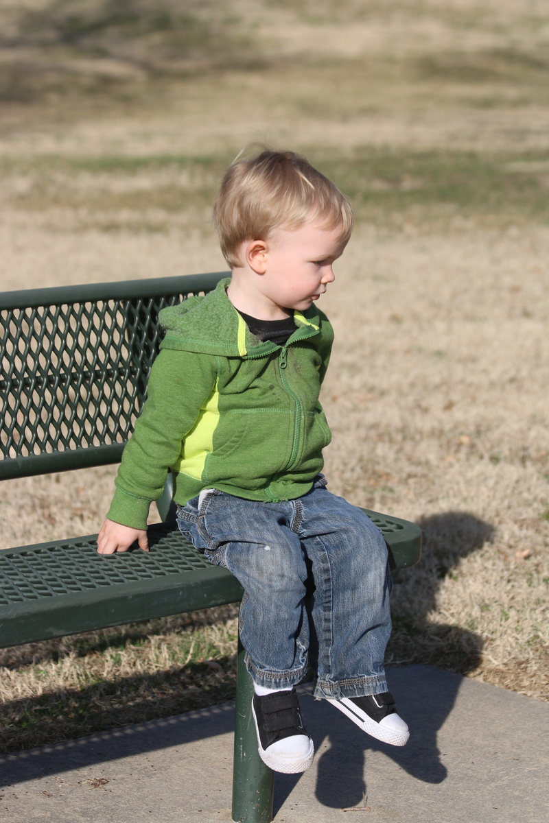 alone, jeans, casual clothing, child, innocence, sitting, outdoors, shadow, stoic, toddler, looking, day, one person, looking away, cute, boys, full length