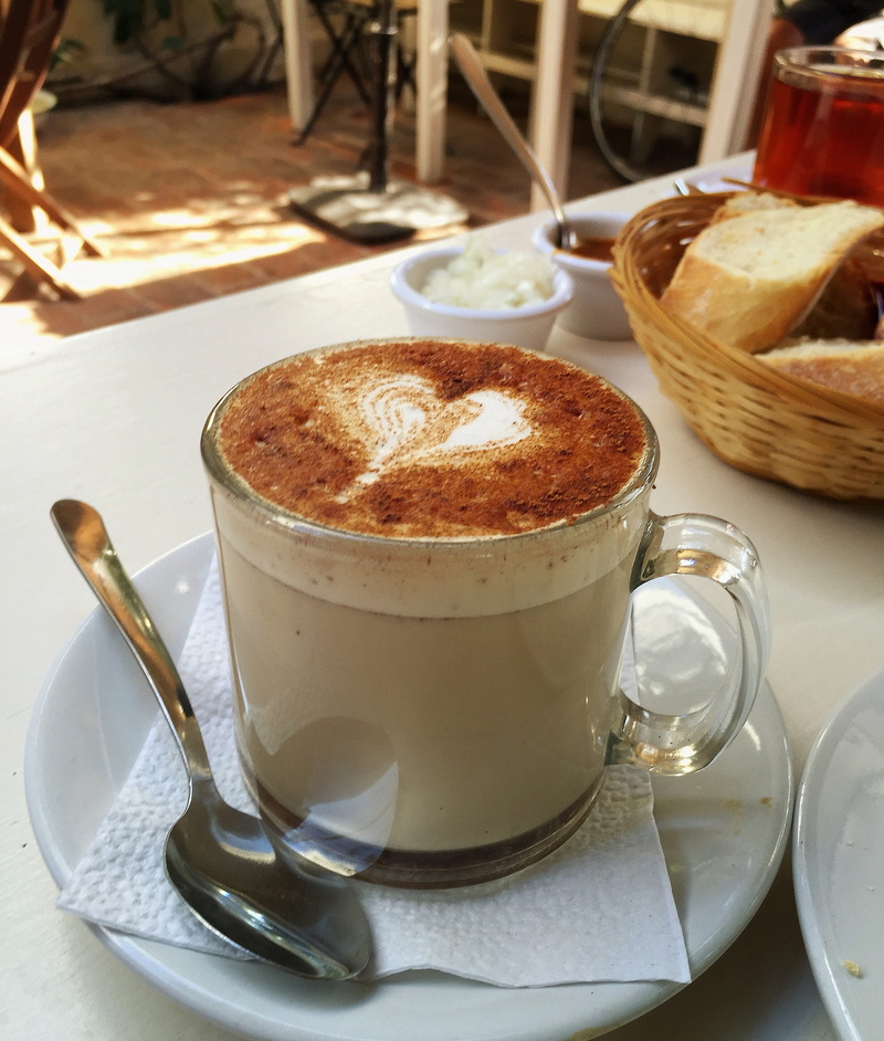 hot drink, froth, coffee cup, kitchen utensil, frothy drink, mug, no people, freshness, table, food and drink, cappuccino, temptation, coffee, spoon, coffee - drink