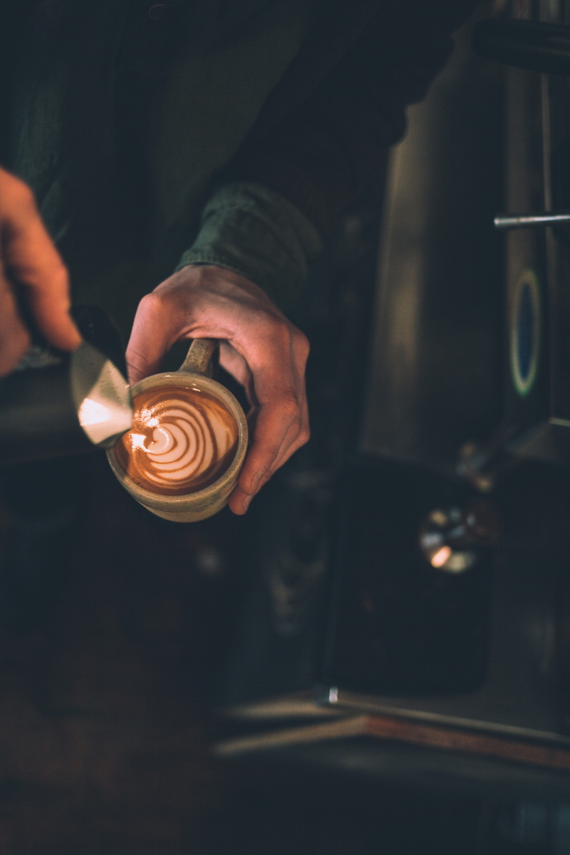 burning, business, capuccino, coffee, cappuccino, real people, freshness, hand, drink, 5K, one person, human body part, indoors, holding, focus on foreground