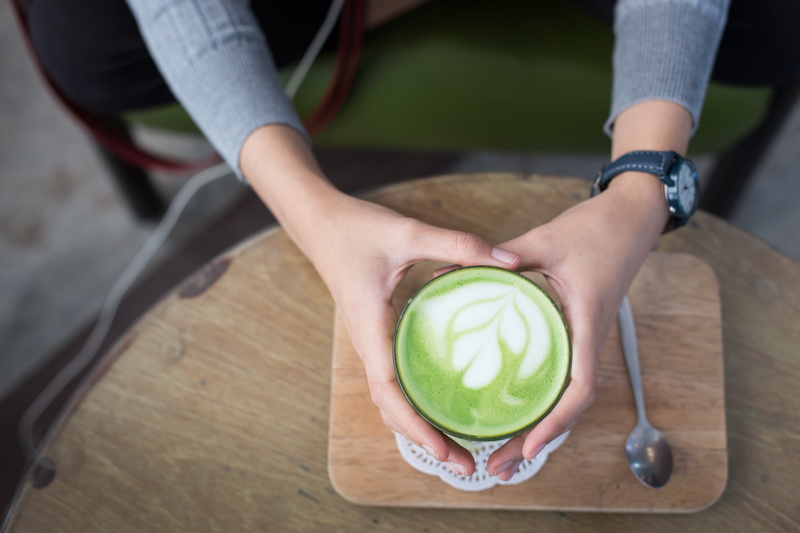 green color, beverage, matcha tea, food, cup, table, adults only, matcha latte, one person, refreshment, latte, capuccino, healthy, human body part, adult