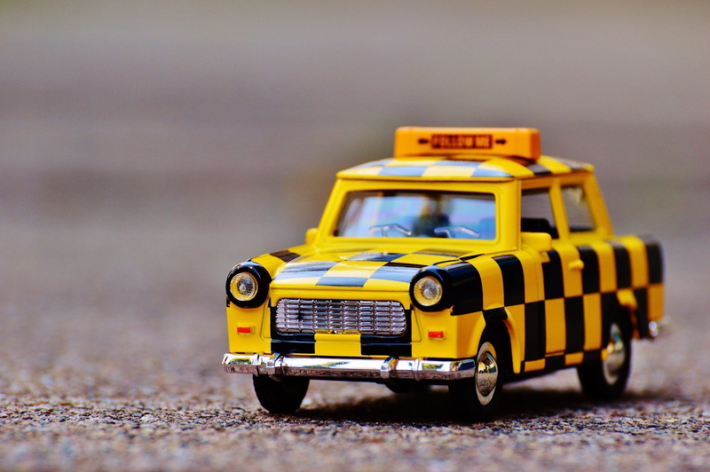 black, toy, land vehicle, focus on foreground, Airport, yellow, transportation, single object, trabi, Carriage, close-up, toys, car, auto, funny, follow-me-carriage