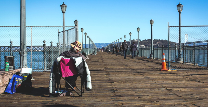 lady, leisure activity, pier, lifestyles, architecture, street light, sky, outdoors, built structure, nature, real people, day, one person, bay, railing