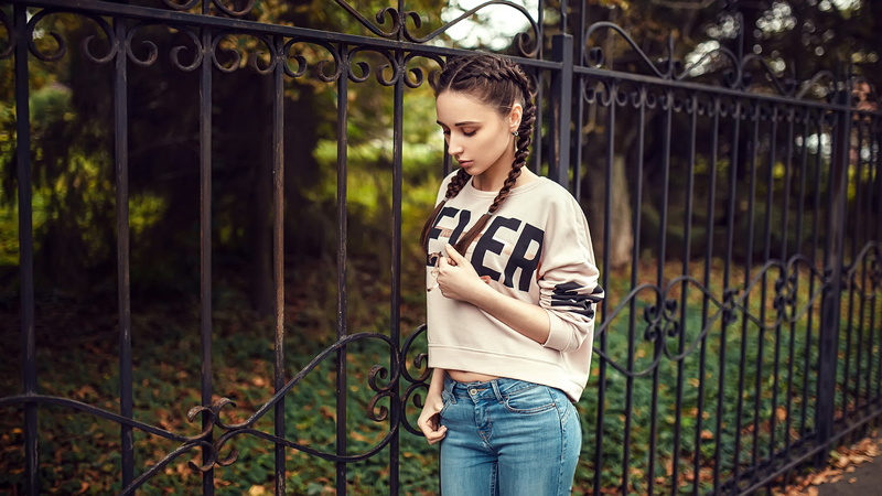 casual clothing, beautiful woman, lifestyles, fence, ever, pigtails, boundary, trees, 1080P, barrier, women outdoors, young adult, focus on foreground