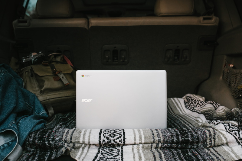 bed, vehicle interior, laptop, computer, indoors, day, one person, furniture, travel ready, technology, denim jacket, explore, communication, google chromebook