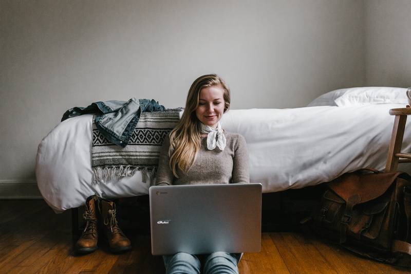 teenager, computer, silver, people, relaxation, front view, women, woman, full length, hardwood floor, photo, using laptop, wireless technology, flooring