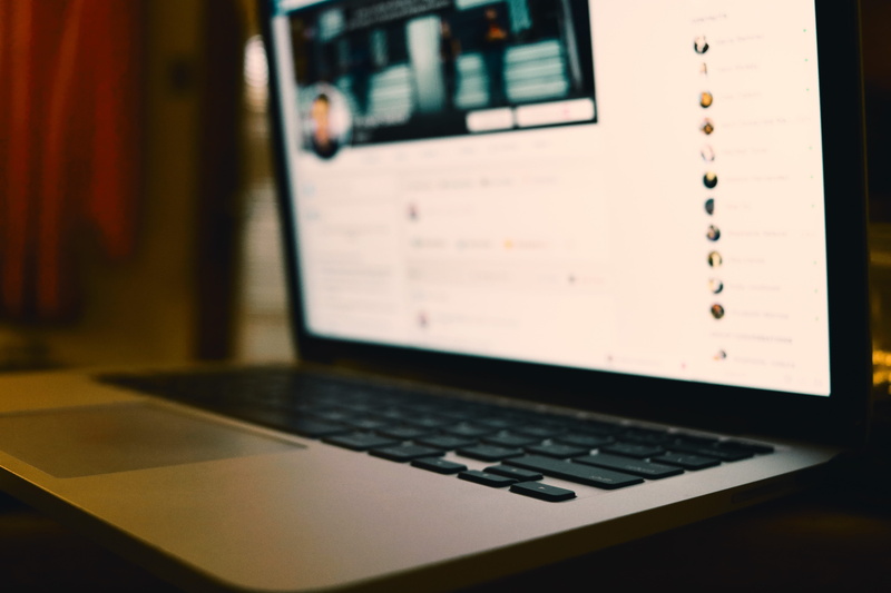 bokeh, computer hardware, social media, open, table, convenience, monitor, display, focus on foreground, laptop, keyboard, facebook, lcd screen, desk, communication