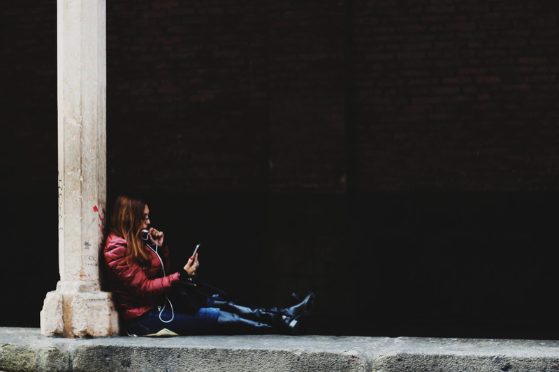 wireless technology, communication, street, sitting, girl, building, real people, smartphone, women, architecture, teenager, full length, young adult, music