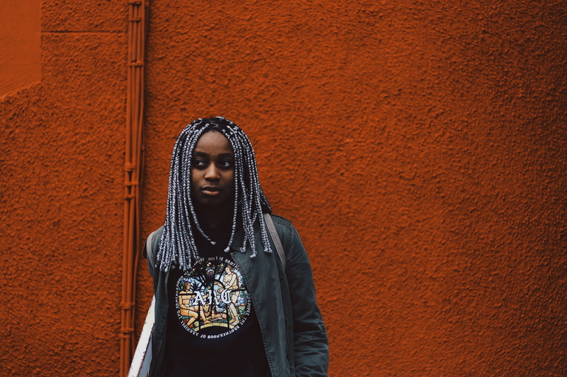 real people, woman, man, dreads, daytime, young women, architecture, painted, outdoors, clothing, fashion, one person, front view, looking, lifestyles