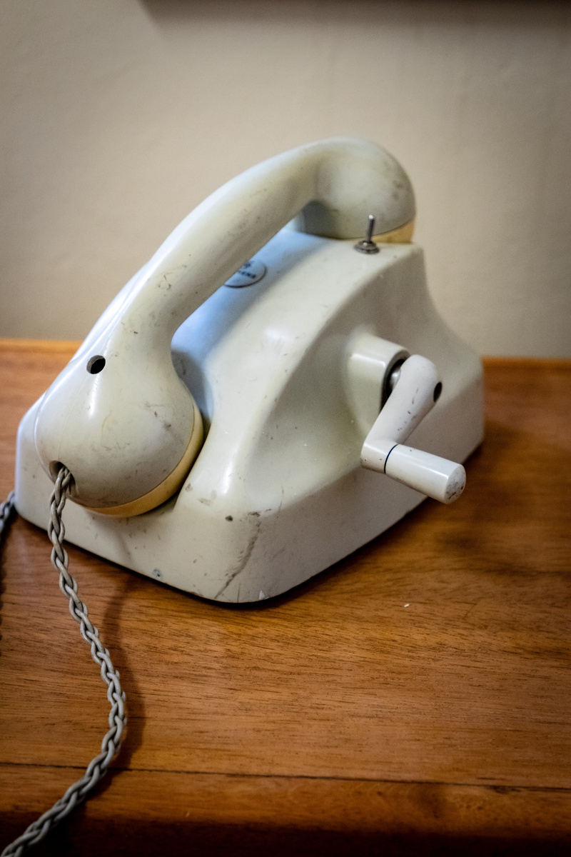 electrical device, clothing, wall - building feature, phone, single object, representation, blow dryer, connection, still life, helmet, adapter, focus on foreground
