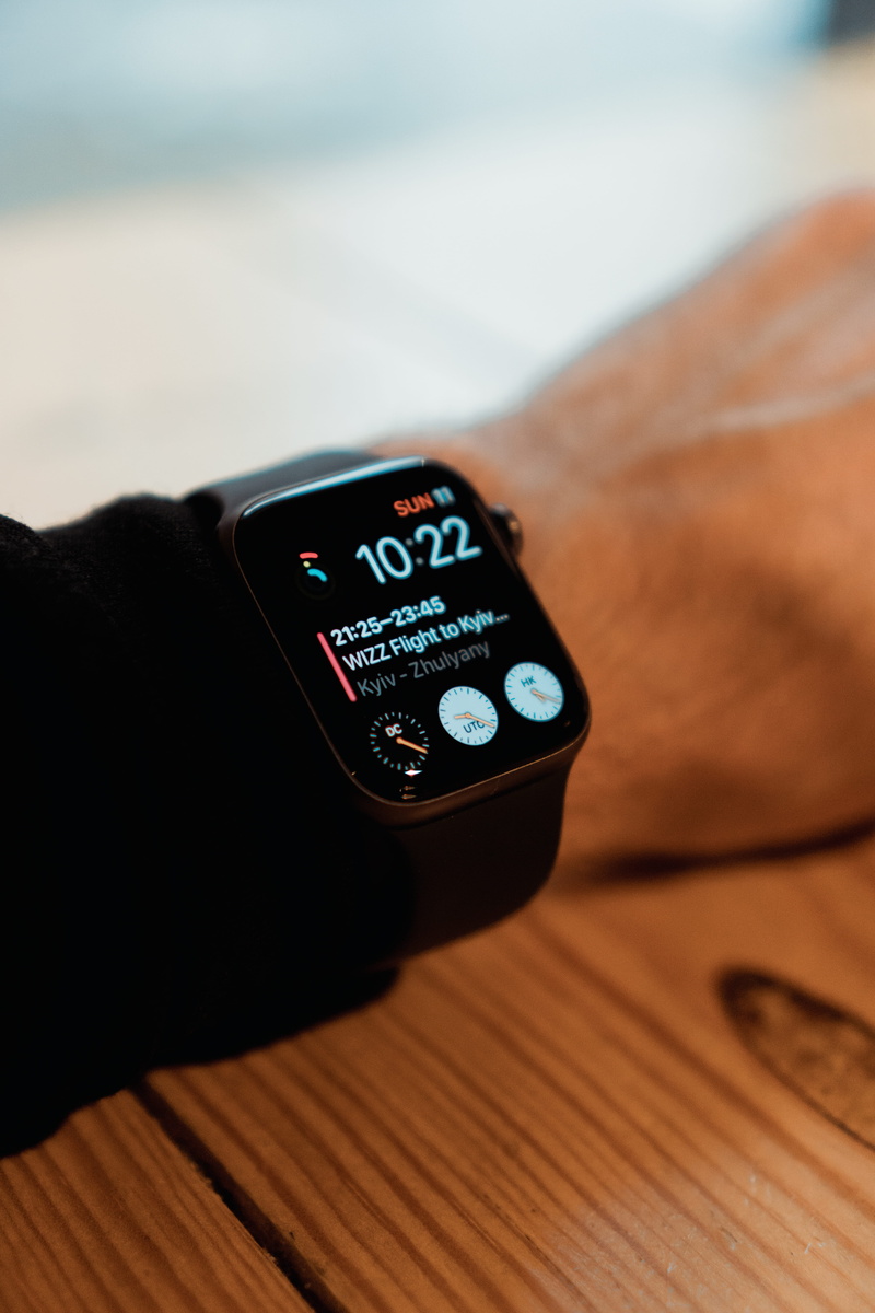 connection, unrecognizable person, indoors, lifestyles, hand, human body part, applewatch, communication, digital display, technology, focus on foreground