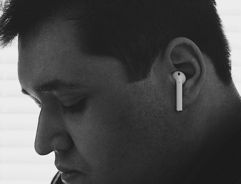 close-up, indoors, human body part, headset, ear, airpods, looking away, one person, white, communication, in-ear, 2K, face, profile view, day, iphone