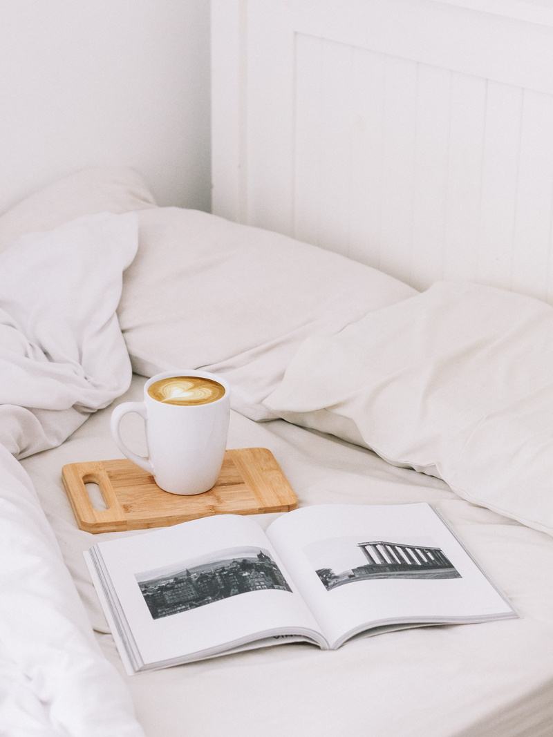 blogging, high angle view, tray, reading, sheets, wood, pillow, no people, drink, refreshment, bedroom, freshness, coffee mug, home interior, mug, relaxation