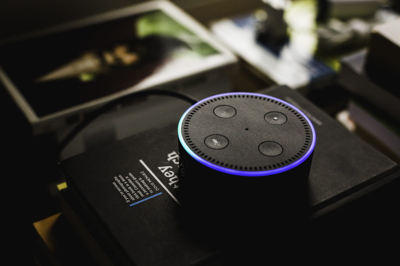 studio shot, dot, high angle view, echo, indoors, no people, echo dot, western script, mode of transportation, amazon, dial, text, still life, single object
