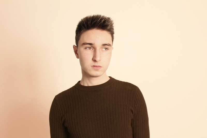 beige background, beautiful people, brown hair, confidence, headshot, studio shot, clothing, man, apparel, somewhere..., knit, brown, colored background