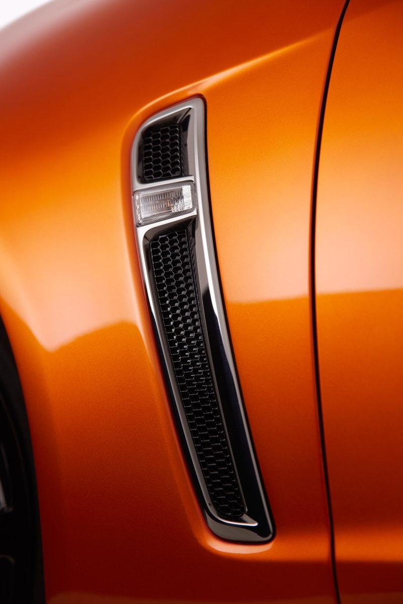 transportation, black color, technology, commodore, indoors, metal, orange color, extreme close-up, vf, no people, motor vehicle, close-up, car, ssv, holden