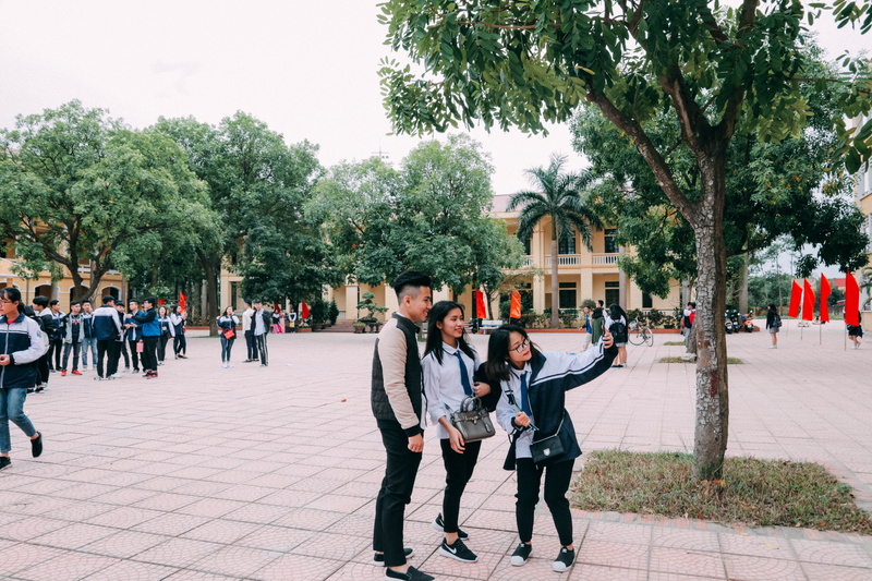 photo, picture, man, day, men, young, group of people, built structure, outdoors, women, people, woman, trees, large group of people, taking, beside, street