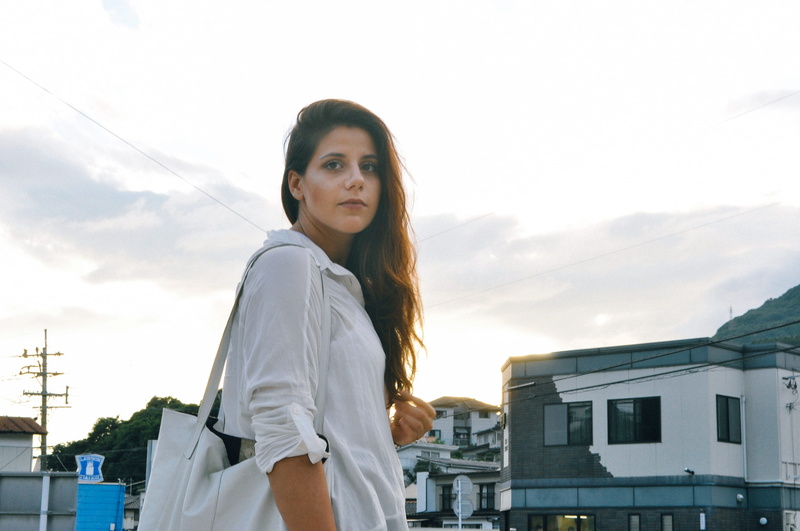 long hair, contemplation, standing, waist up, thinking, inspire, built structure, sky, looking at camera, woman, beautiful woman, lady, leisure activity