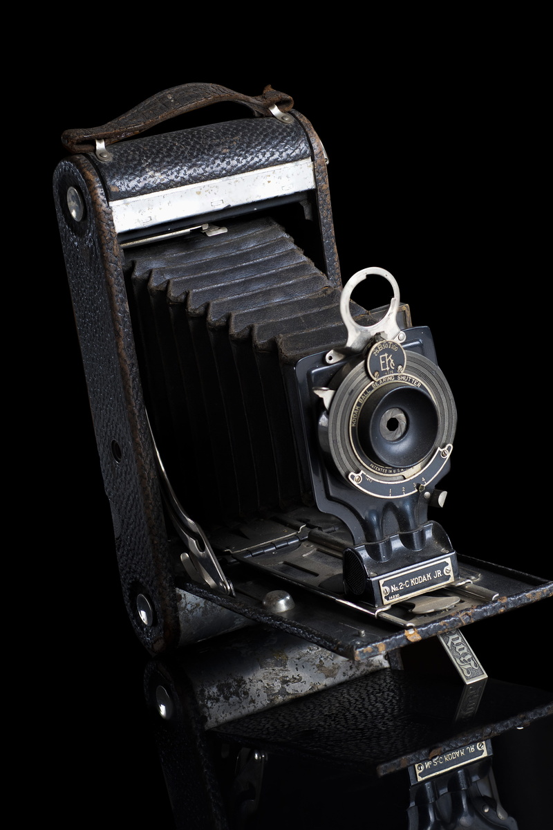 vintage camera, focus, folding, steel, obsolete, antique, nostalgia, classic, gear, shiny, machine part, machinery, no people, black background, retro styled