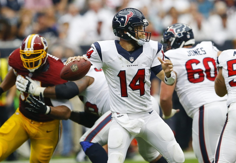 group of people, outdoors, focus on foreground, houston texans, activity, ball, american football - sport, clothing, sportsman, motion, coordination, event