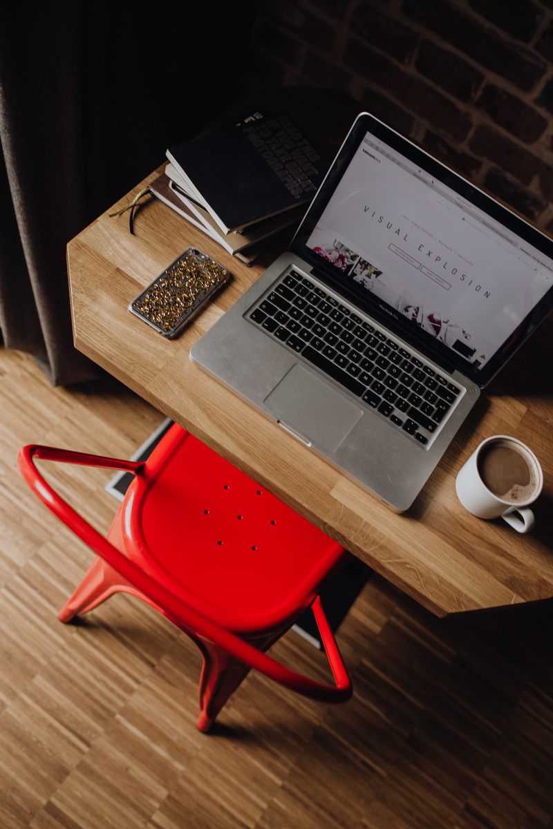 front, still life, industrial, table, chair, books, loft, workspace, no people, portable information device, mug, brick wall, red, work, cup, workplace