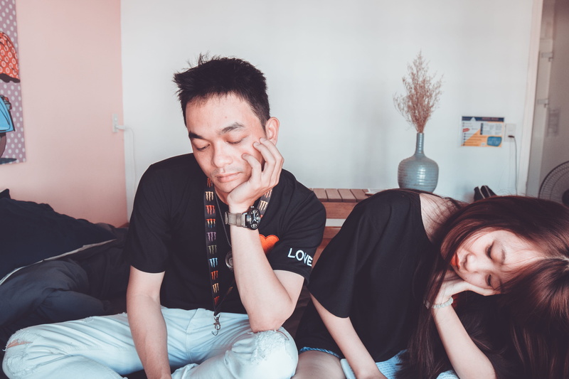 neck, indoors, portrait, couple, young adult, wearing, real people, sitting, women, two, black, lifestyles, hairstyle, home interior, crew, furniture, together