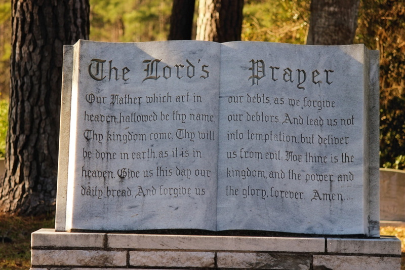 tombstone, nature, Lords Prayer, religious, tree, the past, non-western script, western script, outside, text, no people, bible, focus on foreground, close-up