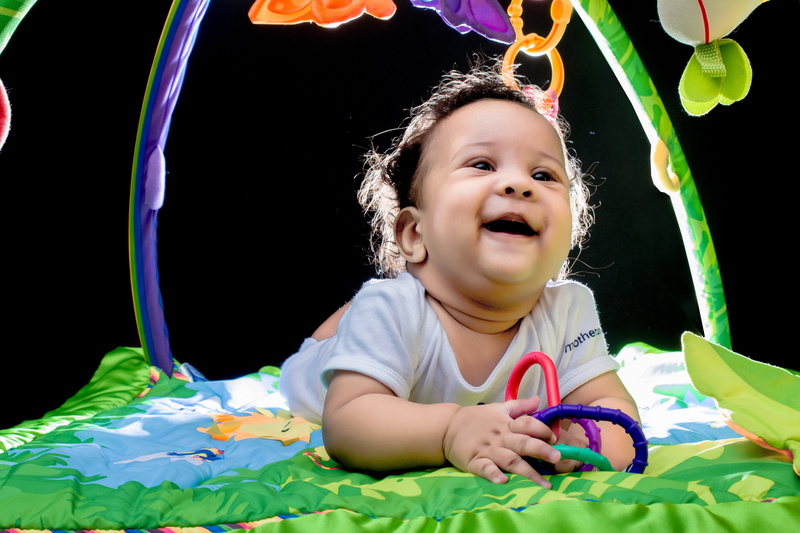 headshot, baby Girls, holding, baby, photographic studio, toy, angel, smiling, omar medina films, playing, front view, portrait, small, smile, emotion