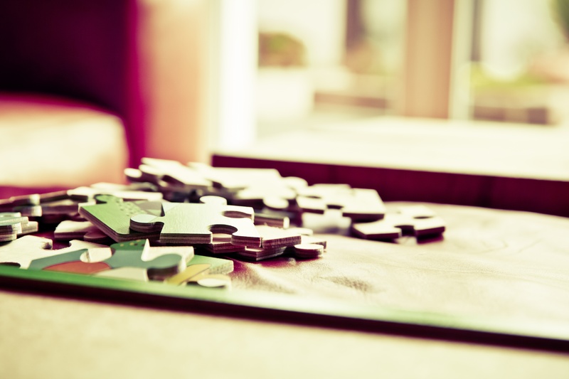 surface level, indoors, puzzle piece, no people, board game, leisure activity, game, strategy, chess piece, selective focus, large group of objects, absence