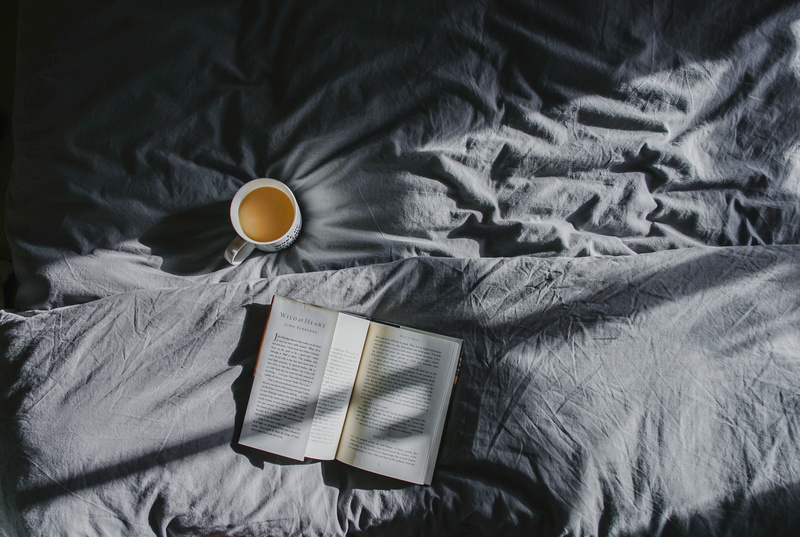 furniture, sheet, drink, relaxation, book, cup, bed, publication, beside, textile, open, breakfast, literature, domestic room, high angle view, food and drink