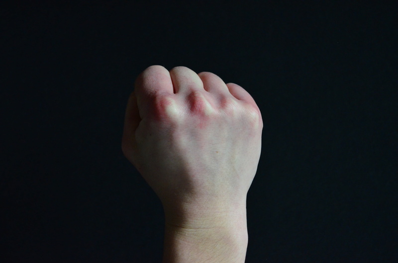 unrecognizable person, negative emotion, hand, clenched, hand signals, aggression, emotion, cut out, human hand, body part, faust, fist, finger, black background