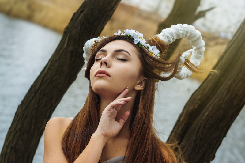 1080P, women model brunette long hair women outdoors face portrait horns flower in hair wavy hair nature trees branch bare shoulders closed eyes hand water