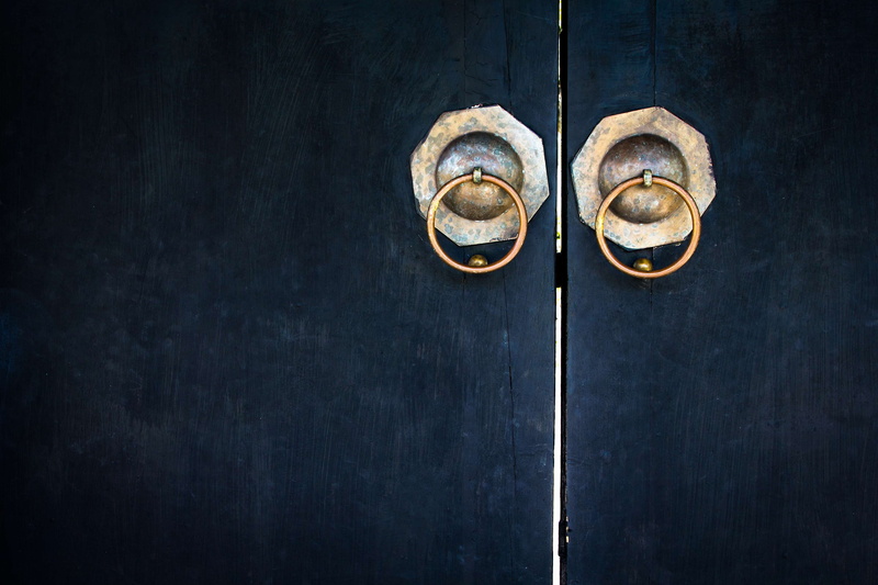 two objects, entrance, temple, wall, old, backgrounds, doorknob, iron, handle, knob, hanging, style, metal, close-up, antique, black color, dirty, texture