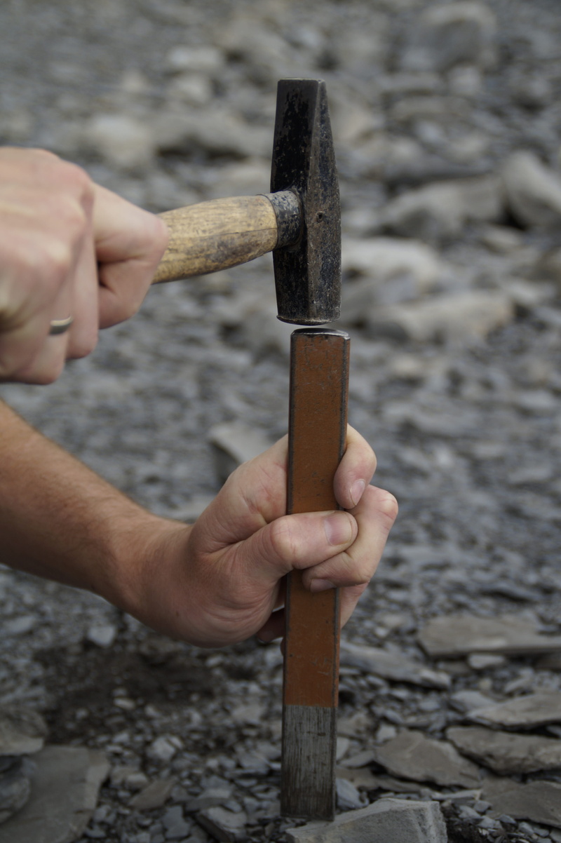 close-up, focus on foreground, knocking stones, tool, paleontology, search for fossils, finger, chisel, outdoors, lifestyles, human finger, human hand