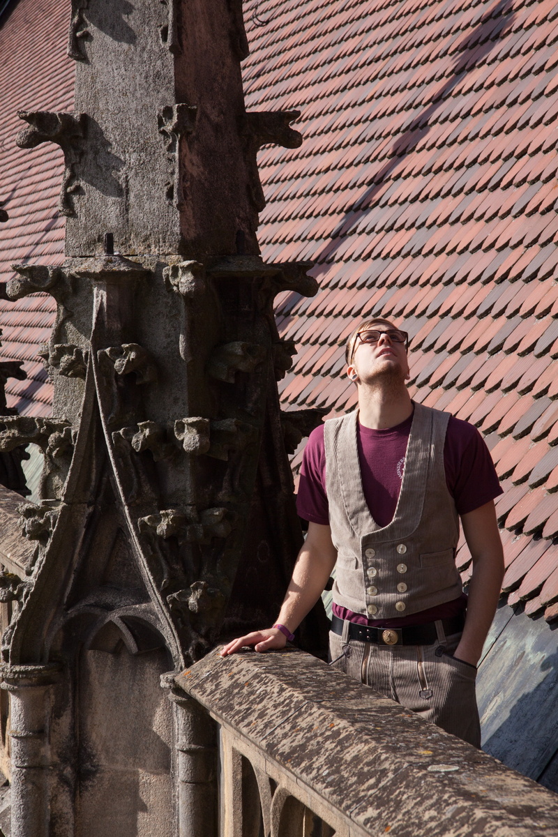 real people, ornaments, upward, one person, architecture, old, built structure, trade clothing, railing, parapet, person, standing, city, stone, training