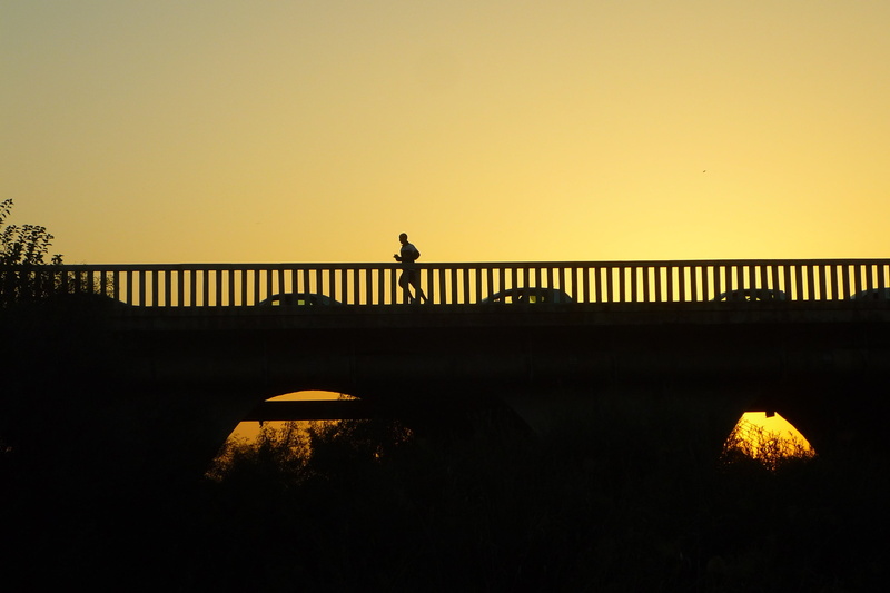 sport, bridge - man made structure, copy space, orange color, water, handrail, career, sunset, yellow, nature, solo, one person, bridge, sky, run, clear sky