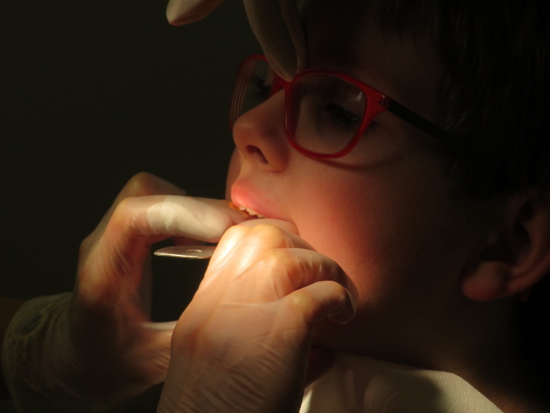 close, one Person, intervention, child, dentist, indoors, dental braces, eyeglasses, wireless technology, dentition correction, dark, black background