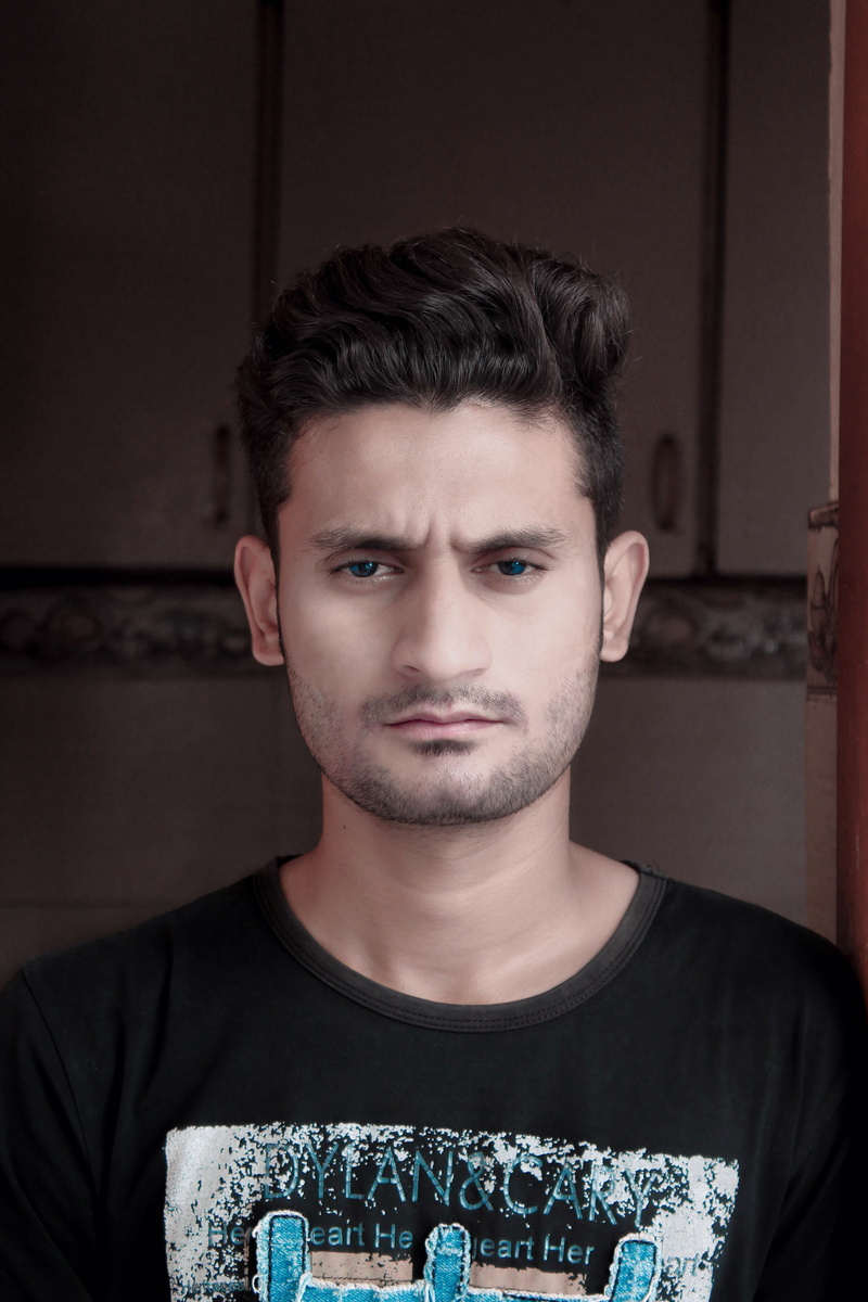 confidence, looking, t-shirt, neck, beard, fashion, young, lifestyles, person, headshot, model, looking at camera, young men, black, indoors, contemplation
