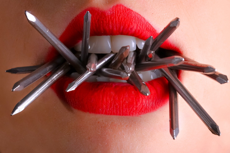 indoors, freshness, person, red, group of objects, food, female, photoshoot, eating utensil, biting, metal, skin, table, lady, table knife, colors, sharp