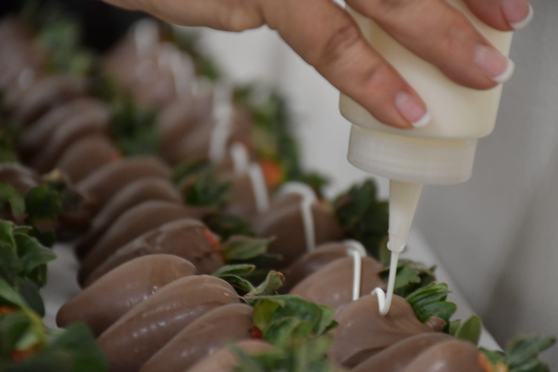 body part, cake, confectionery, plant, hand, culinary, preparing food, finger, human, pasta, produce, freshness, icing, unrecognizable person, meal, creme