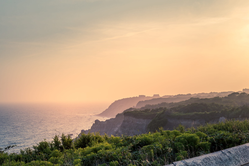 ocean, outdoors, beauty in nature, land, cloud - sky, dirt, rocks, orange, island, rhode island, plant, united states, dunes, landscape, mountain, no people