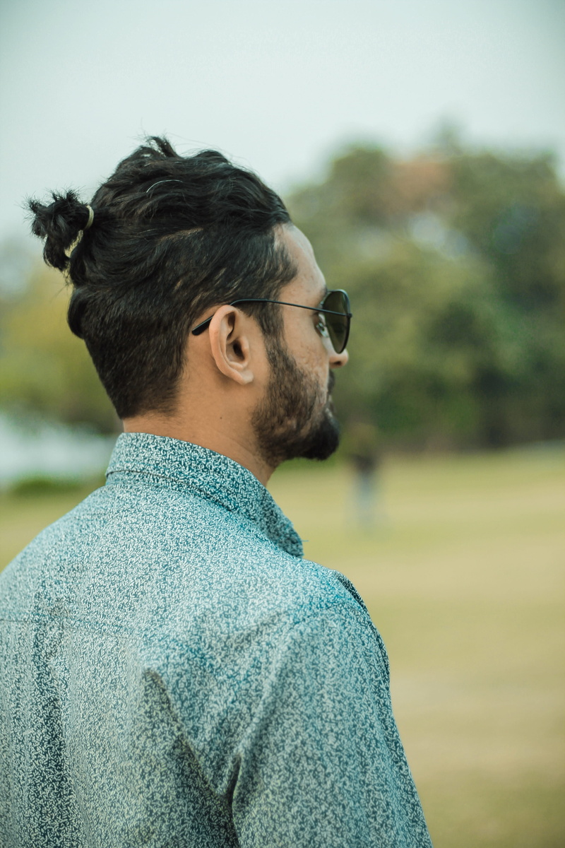 portrait, hair, contemplation, focus on foreground, outdoors, beard, hairstyle, person, headshot, gray, dress, young men, glasses, lifestyles, fashion