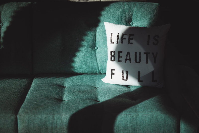 human body part, human limb, couch, black, human foot, western script, casual clothing, sofa, pillow, indoors, beautifull, teal, number, 5K, jeans, textile