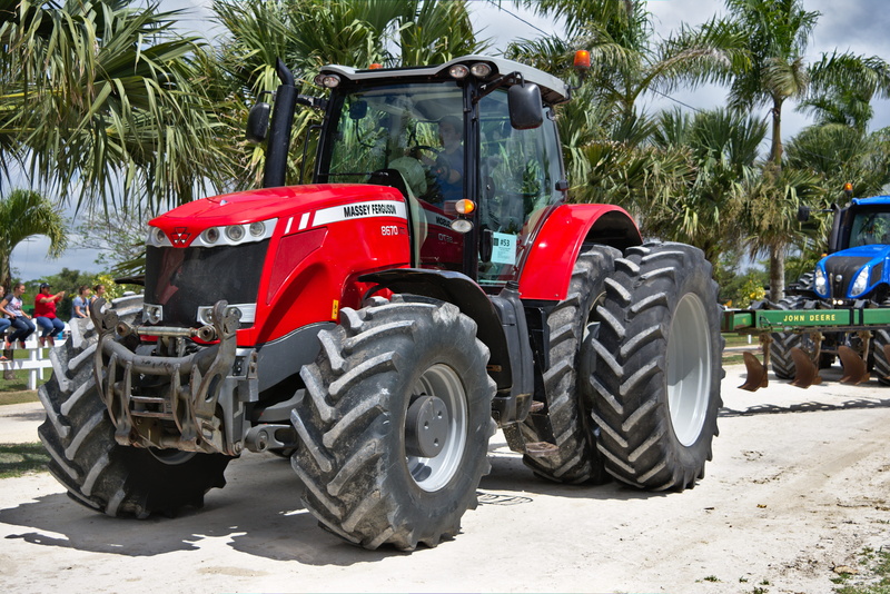 equipment, incidental people, wheel, tread, outdoors, tire, heavy, tree, mode of transportation, plant, belize, field, palm tree, 5K, vehicle, red, spanish lookout