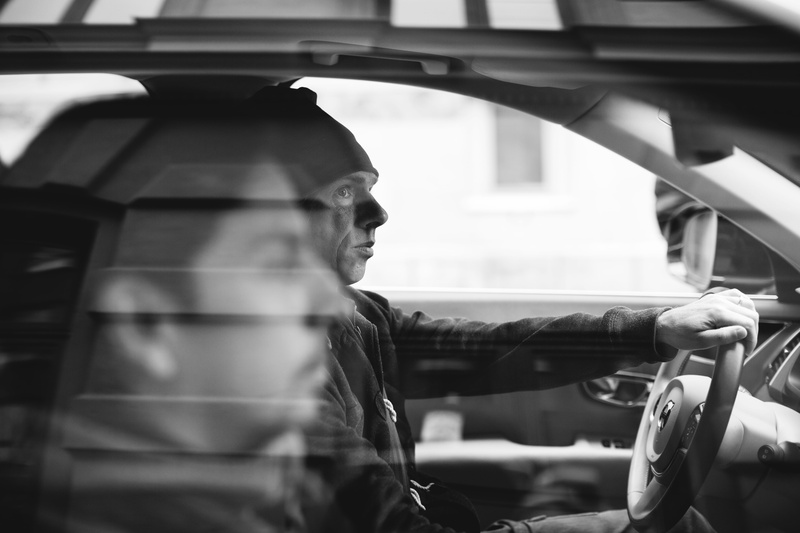 real people, adult, mode of transportation, volvo, time, outdoors, man, selective focus, reflection, side view, black and white, go, transportation, men